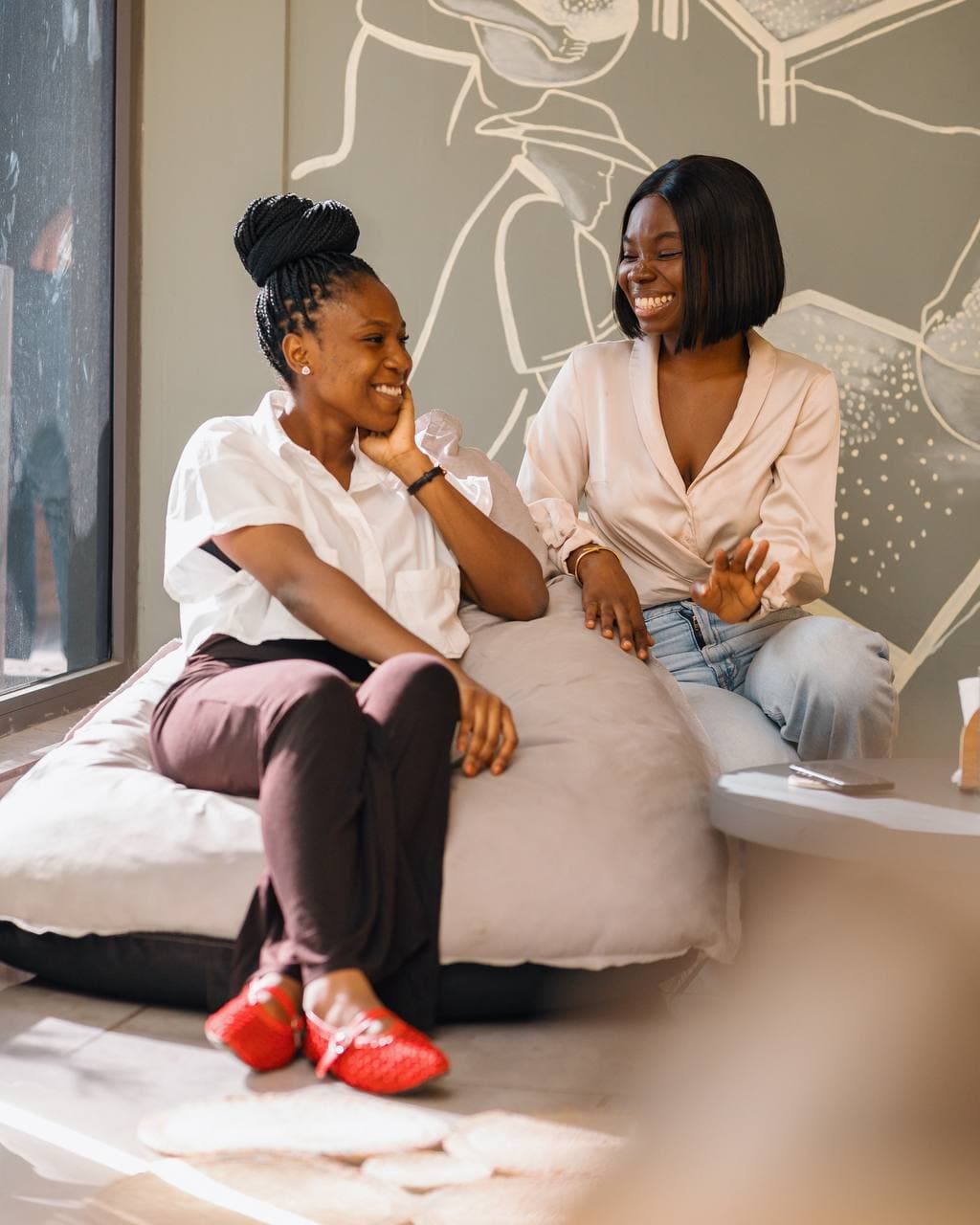 Two marketers talking through a mentorship session